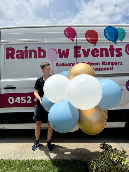Bright, festive balloons in gold, silver, and black, with 'Happy New Year' messages, arranged in celebration for a New Year's Eve party, New Year's Eve Balloon Arch