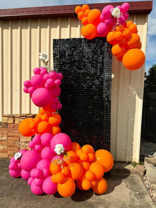 Shimmer wall display with twinkling sequins and a mix of balloon decorations creating a stunning focal point for a corporate event,Luxurious shimmer wall backdrop with a festive balloon bouquet, ideal for a wedding reception, Photo-ready shimmer wall with cascading sequins and a coordinated balloon garland in pastel colors for a baby shower, Glamorous event setup featuring a sparkling shimmer wall and a colorful balloon arch for a birthday party,